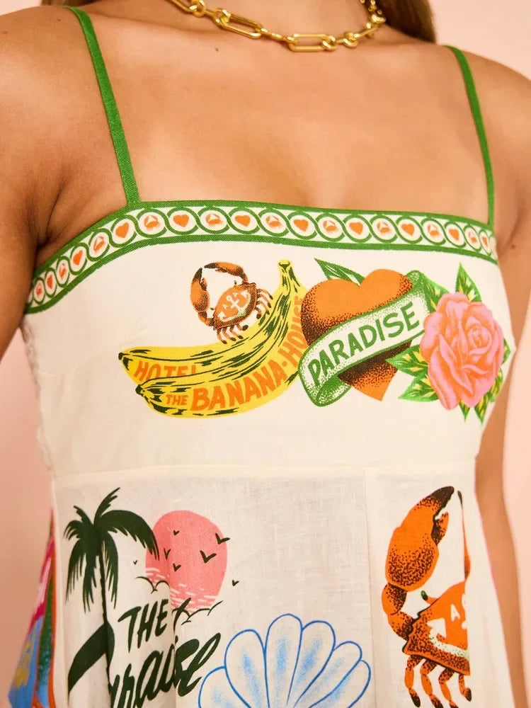 Colorful sleeveless top with tropical-themed graphics and text.