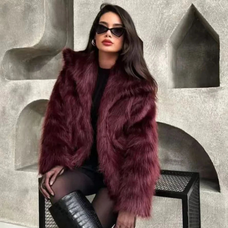 Woman wearing a fur coat and sunglasses in an urban setting