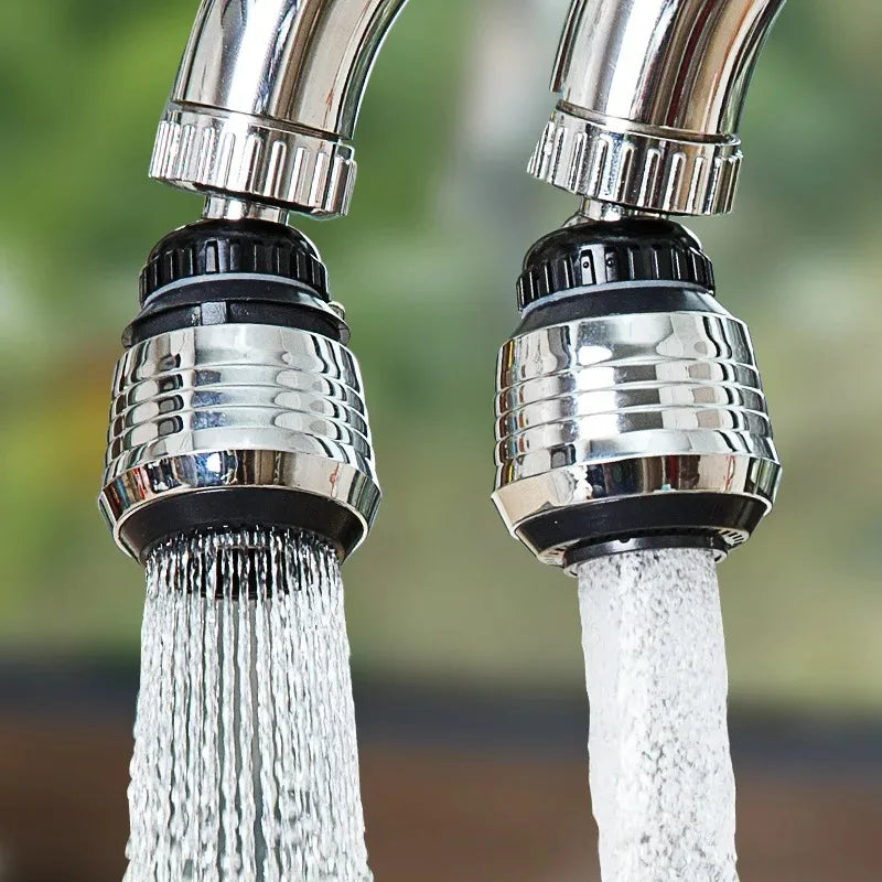 Two faucet nozzles with water flowing outdoors