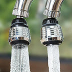 Two faucet nozzles with water flowing outdoors