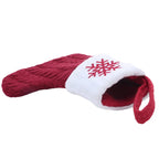 Red and white dog toy with snowflake design on a white background