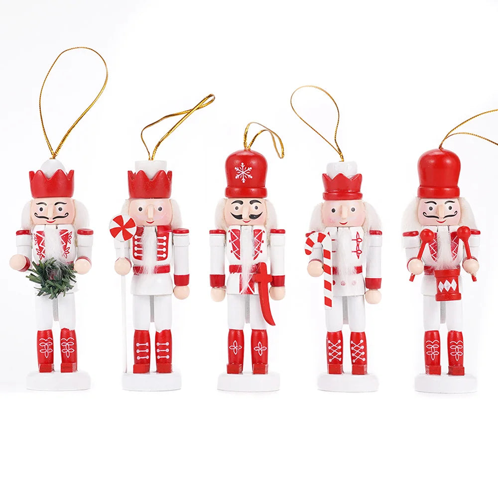 Set of five Nutcracker Christmas ornaments in red and white on a white background
