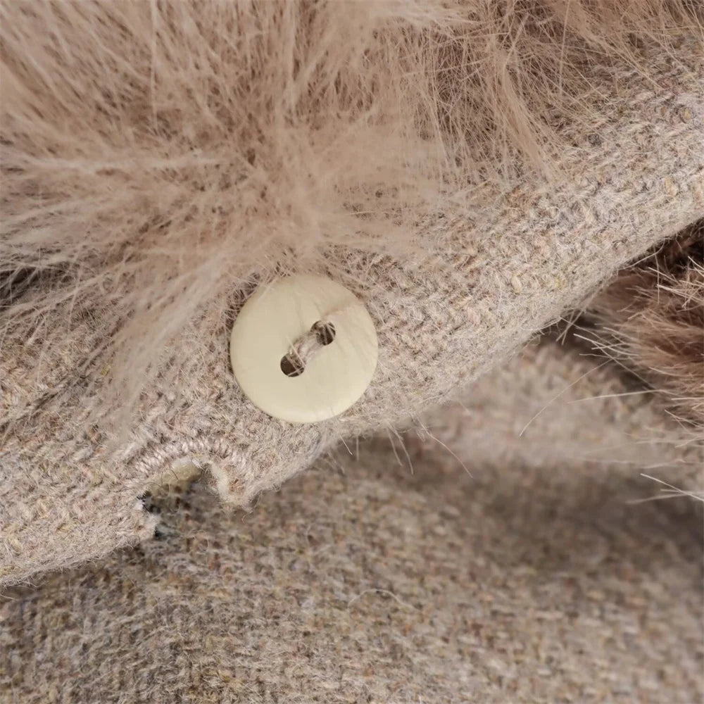 Close-up of a button on a textured fabric surface