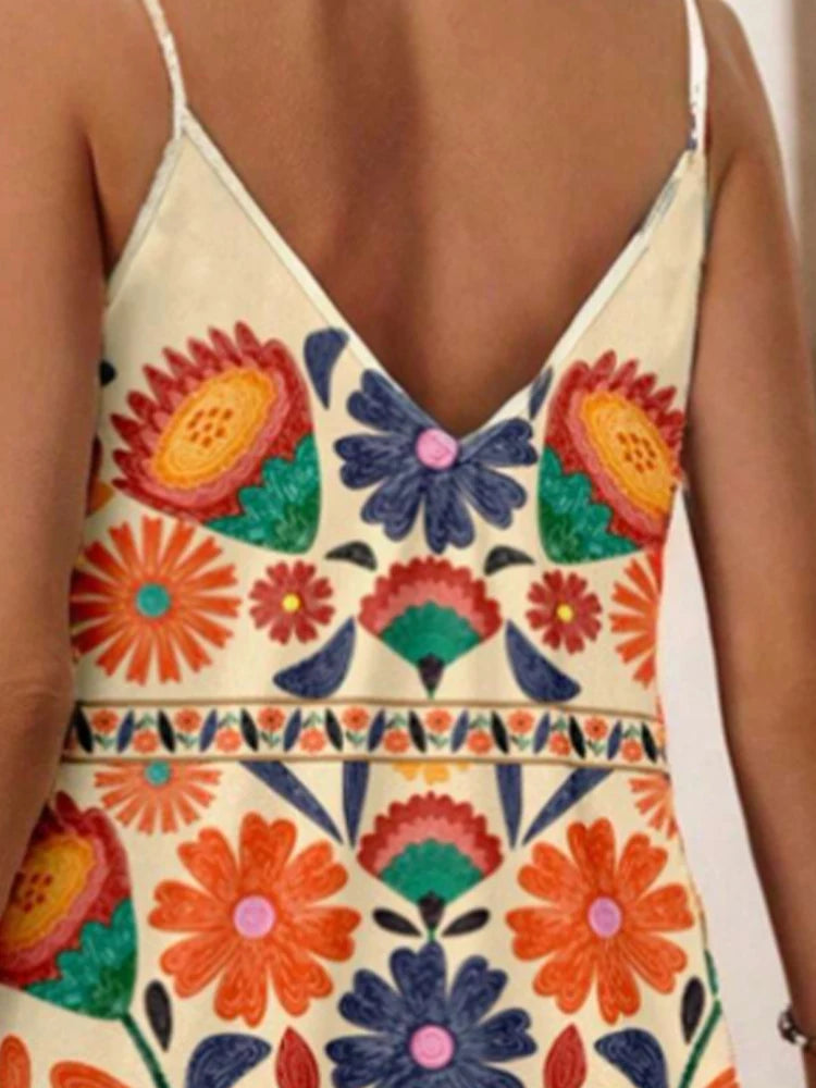 Colorful floral and butterfly patterned dress with a deep neckline.