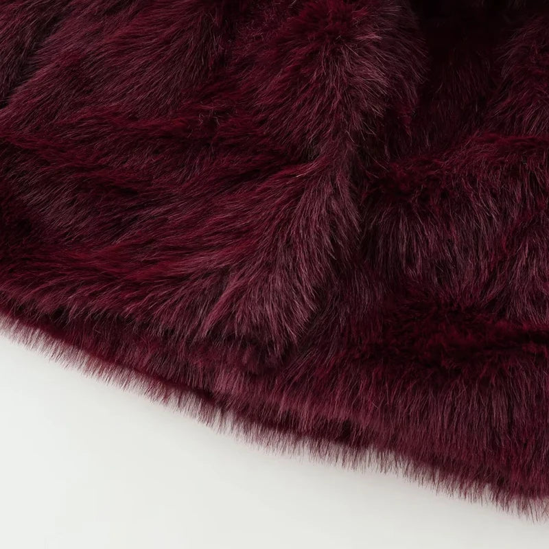 Close-up of dark purple faux fur on a white background