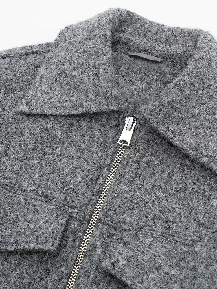 Gray coat with a zipper detail on a white background