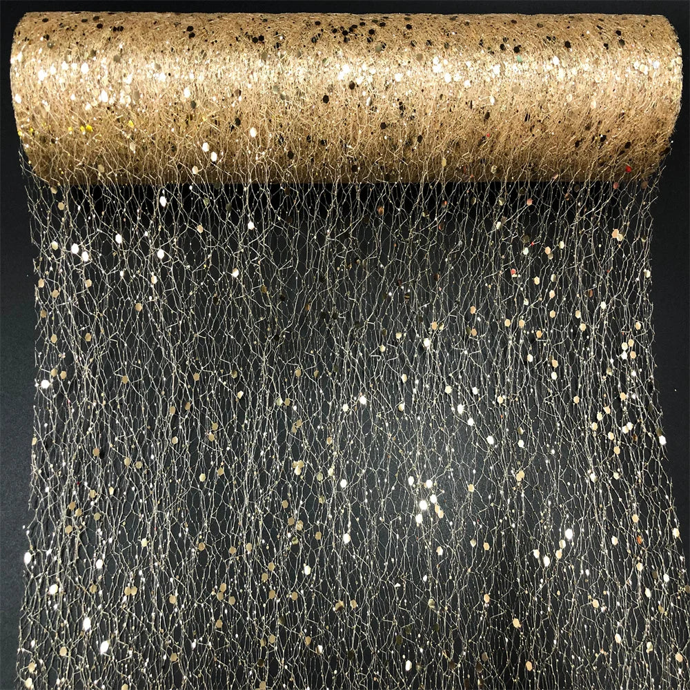 Roll of gold and silver glittery netting on a black background