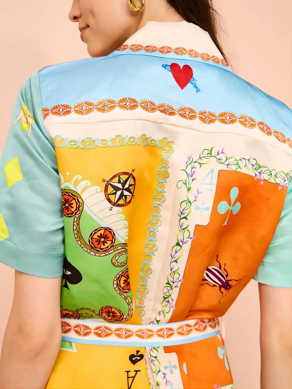 Colorful patterned shirt with a heart design on a beige background