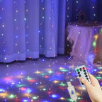 Colorful string lights on a floor with a remote control in a room setting.