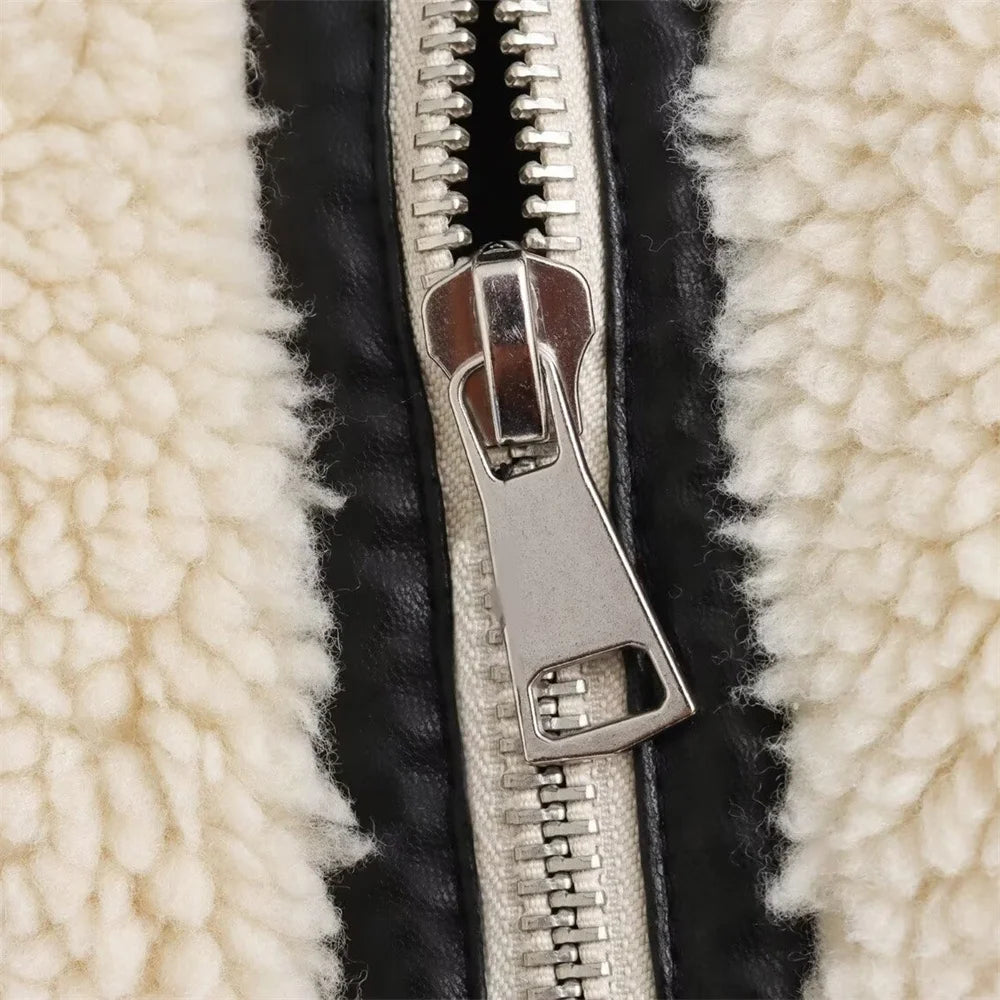 Close-up of a zipper on a textured fabric background