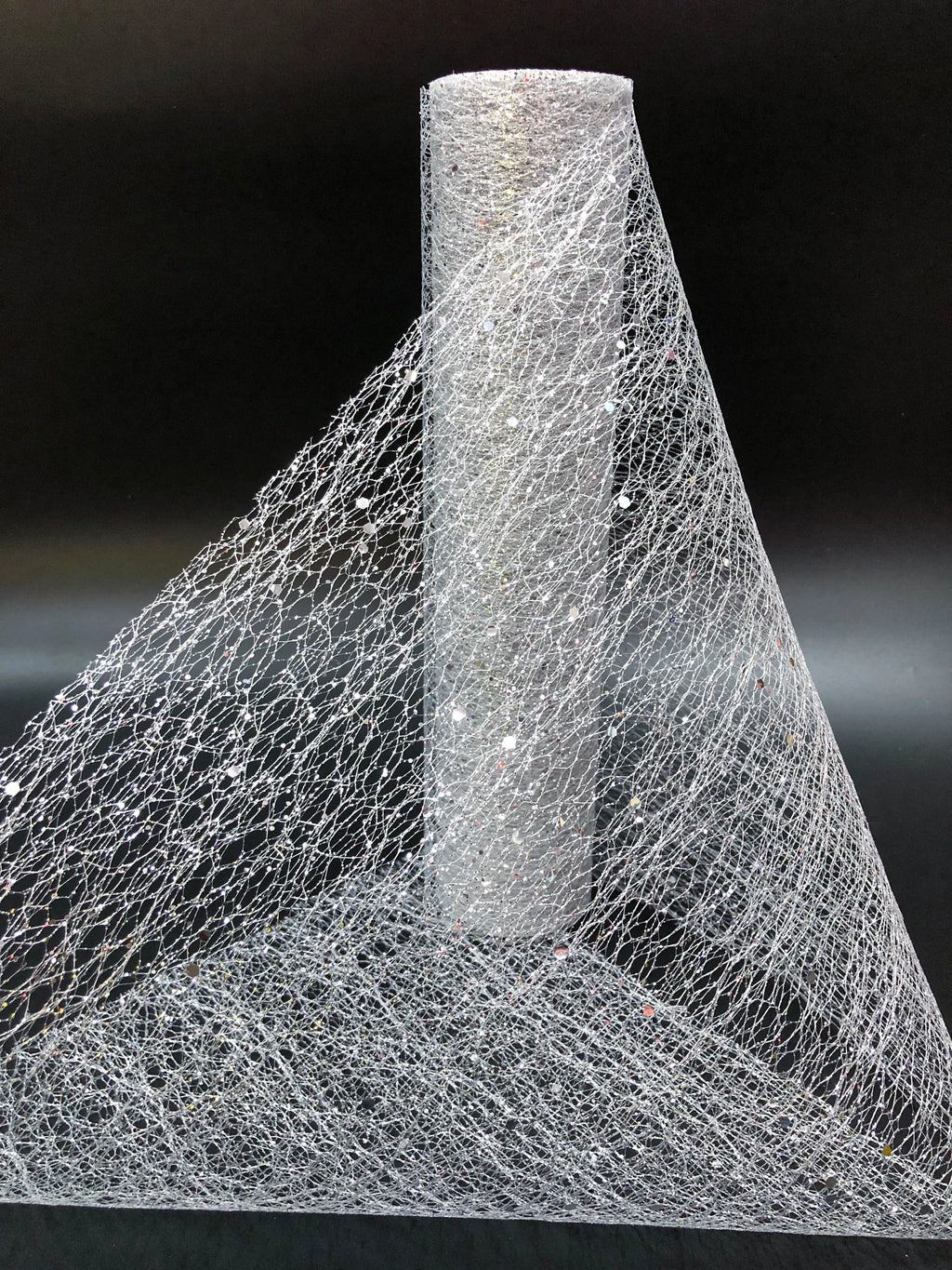 Close-up of a cone-shaped object made from a fibrous material on a black background