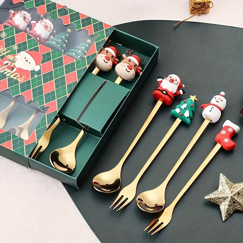 Set of gold Christmas-themed spoons and forks with decorative handles on a dark surface.