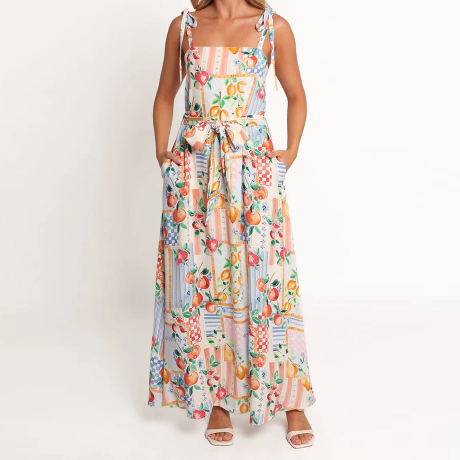 Woman wearing a colorful floral dress on a white background