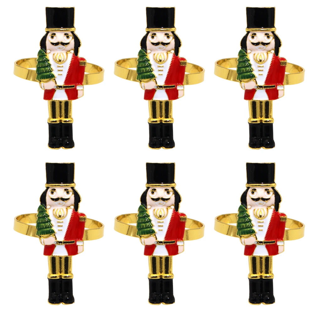 Set of six nutcracker-shaped napkin rings on a white background