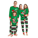 Family wearing matching Christmas pajamas with Santa Claus designs on a white background