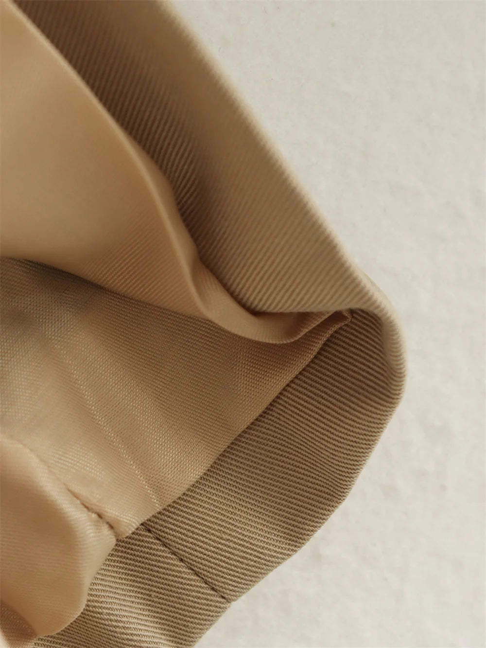 Close-up of beige fabric with a textured surface