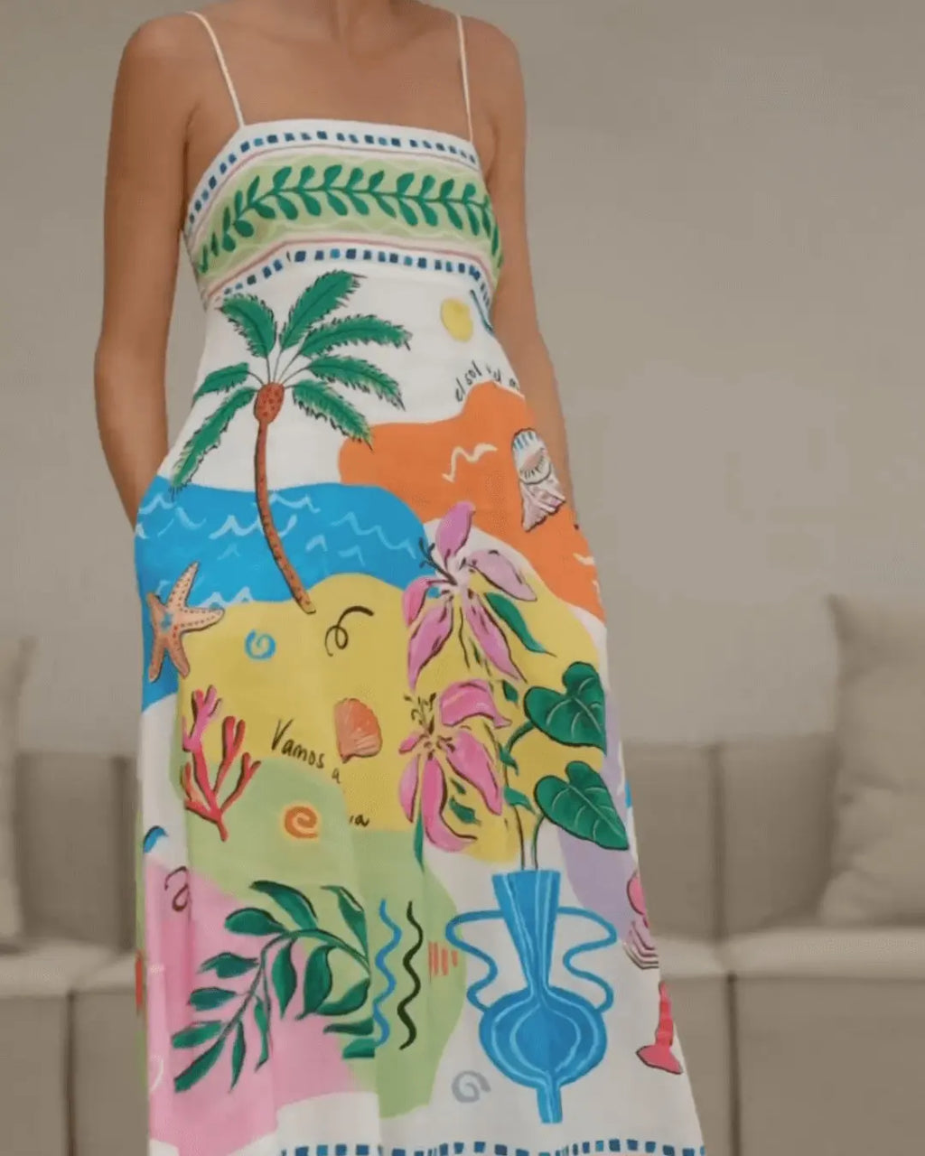 Colorful dress with tropical patterns worn by a person indoors
