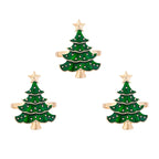 Three green Christmas tree-shaped hair clips with gold bases on a white background
