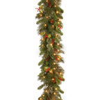 Christmas garland with lights and berries on a white background