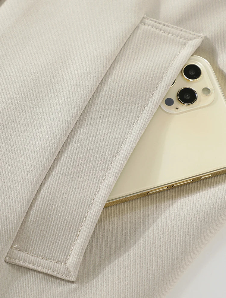 Phone case with a phone inside on a light beige fabric background