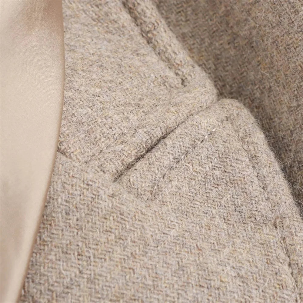 Close-up of a textured beige fabric with a subtle pattern
