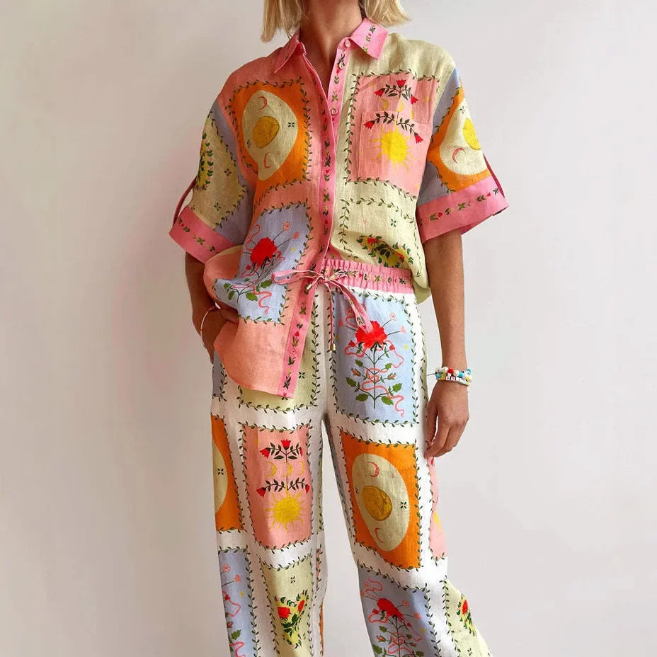 Colorful patchwork outfit with floral and abstract patterns on a plain background