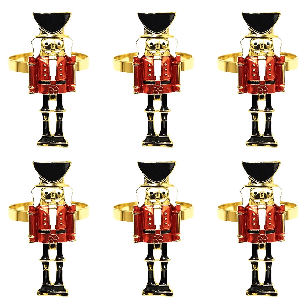 Set of six nutcracker-shaped napkin rings on a white background