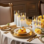 Elegant table setting with candles, gold glasses, and yellow flowers.