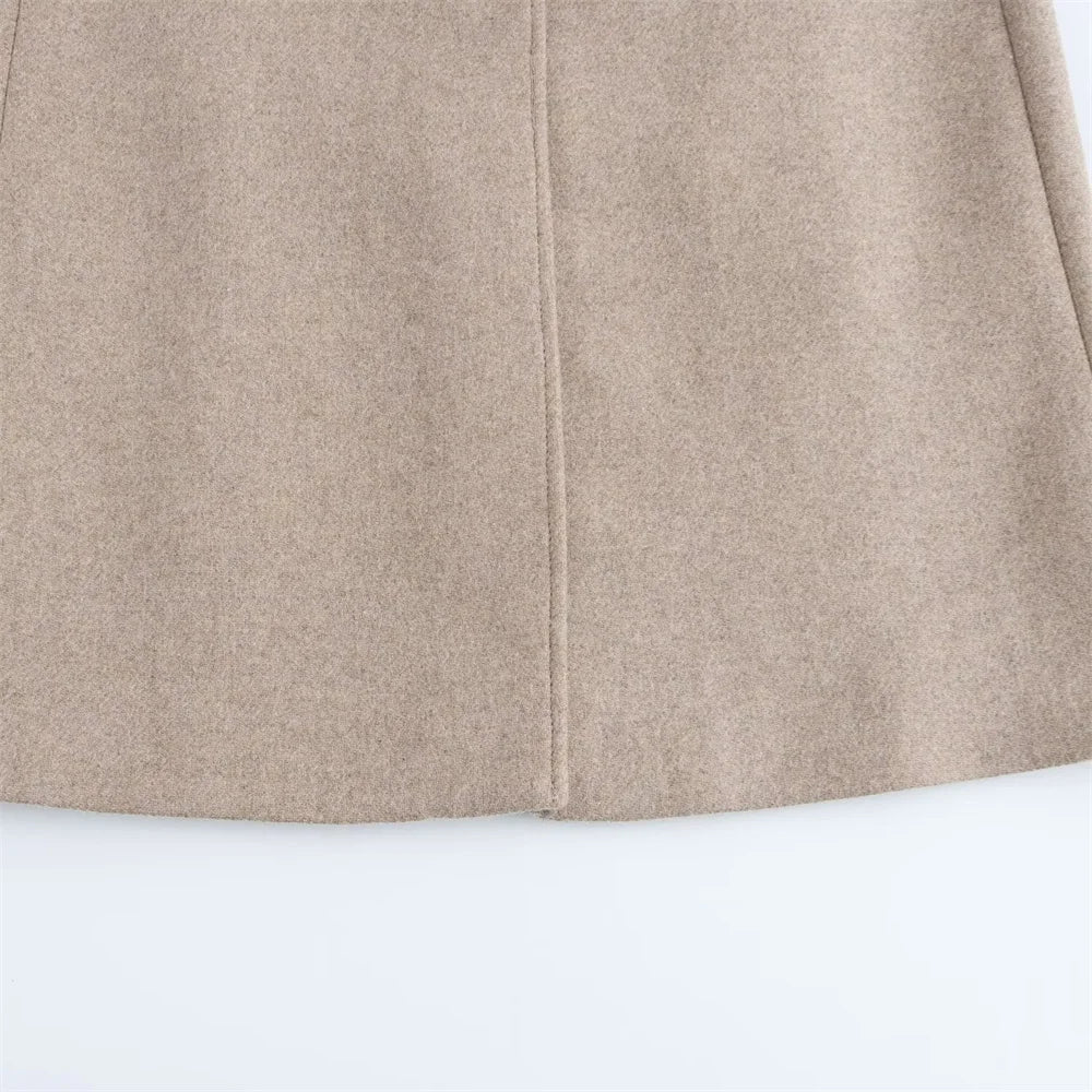 Close-up of a beige skirt on a white background