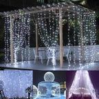 String lights draped over a pergola with outdoor furniture underneath, creating a festive atmosphere.