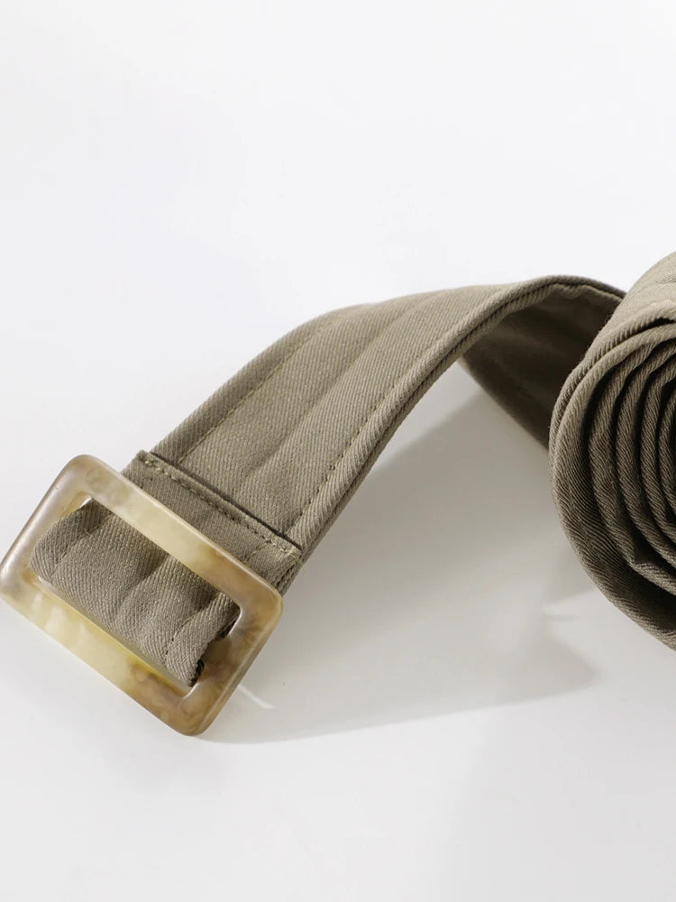 Khaki belt with a brass buckle on a white background