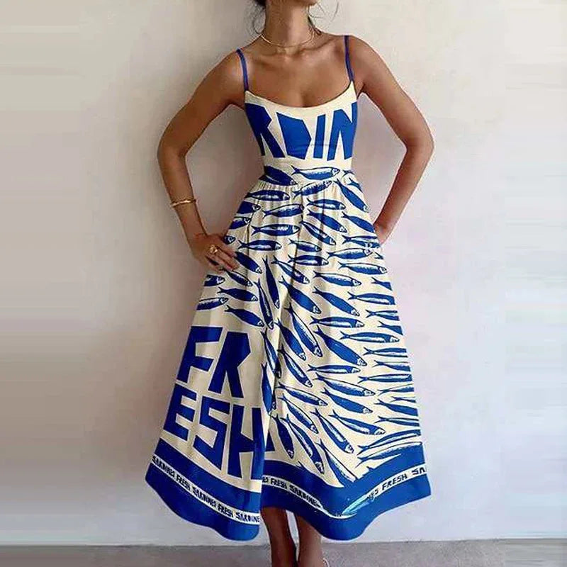 Person wearing a blue and white dress with 'FRESH' text and fish pattern.