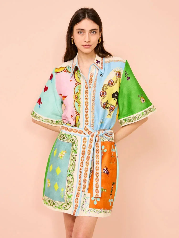 Woman wearing a colorful patterned dress on a beige background
