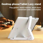 White phone/tablet lazy stand on a desk with text describing its uses.