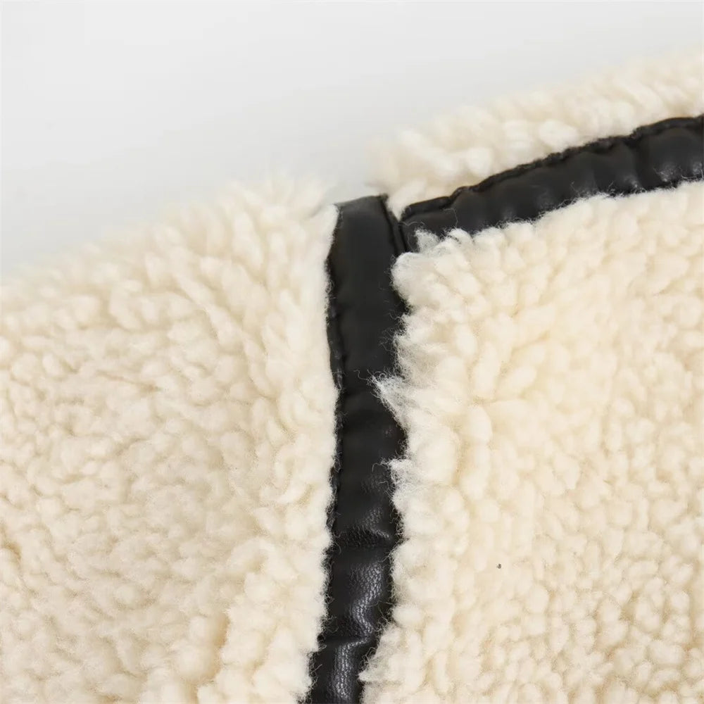 Close-up of textured fabric with a black border on a light background