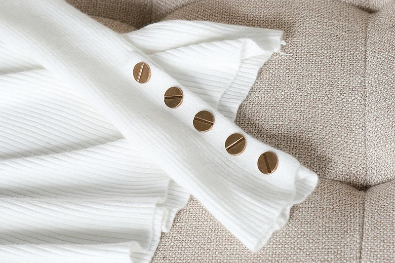 White paper with brown circles on a textured beige surface