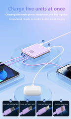 Charging hub with multiple cables and devices on a light blue background