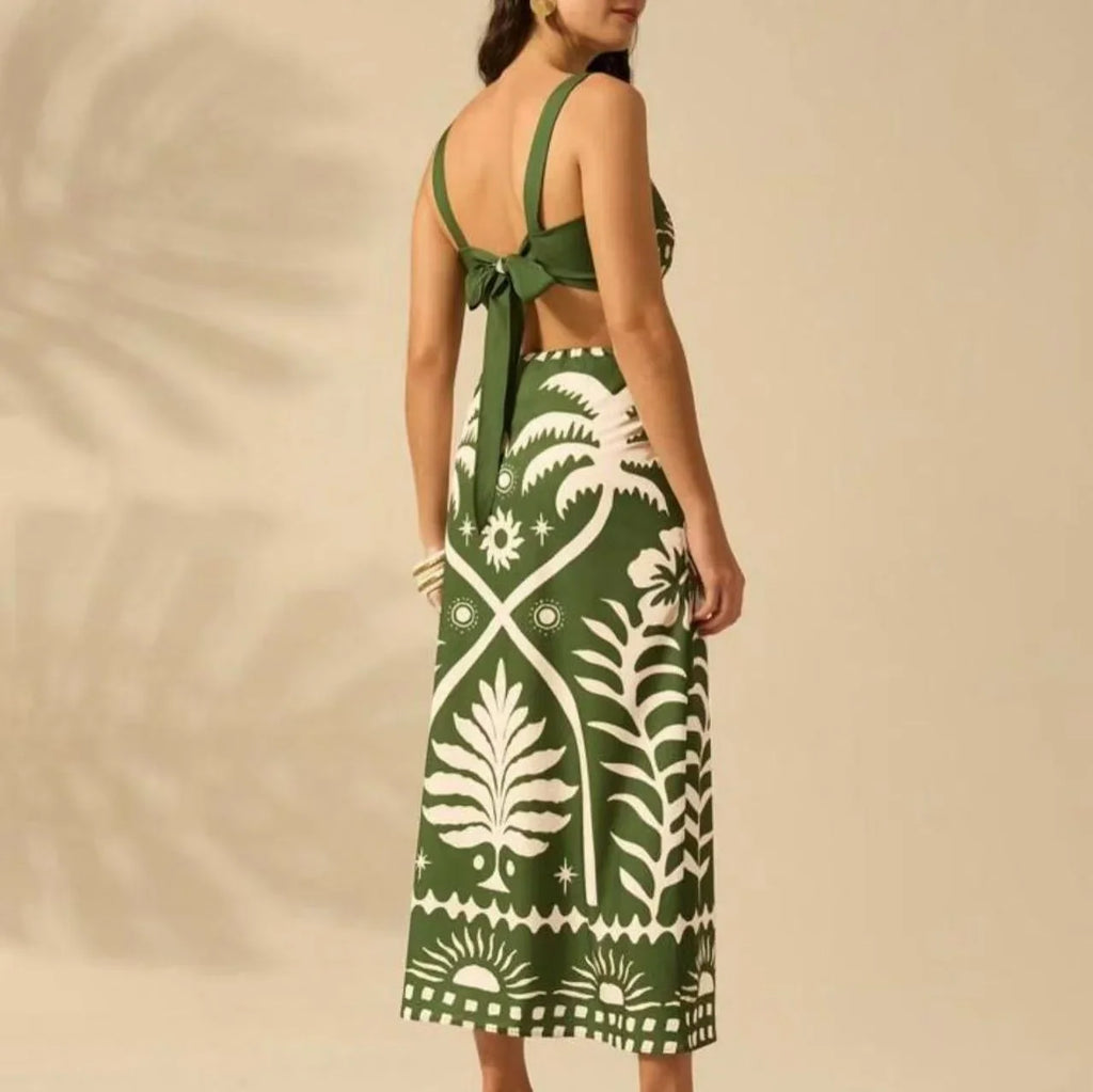 Woman wearing a green and white patterned dress with a beige background